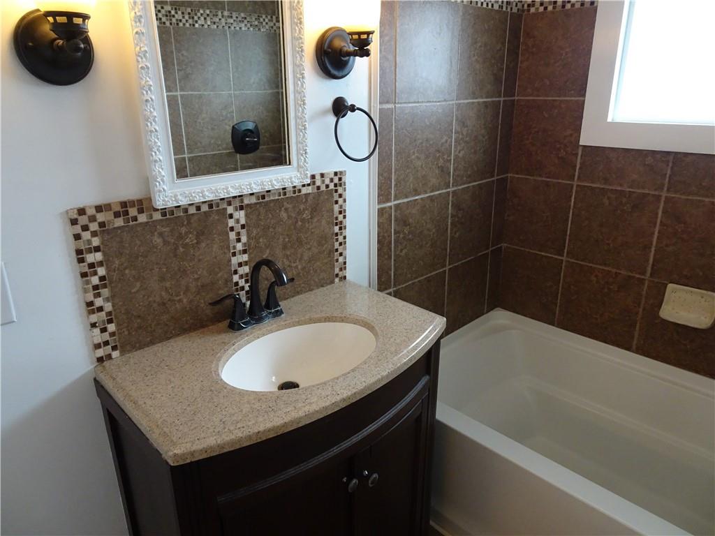 42 Oak Street Manor, PA 15665 - Photo 36 of 39 a bathroom with a sink a toilet and shower