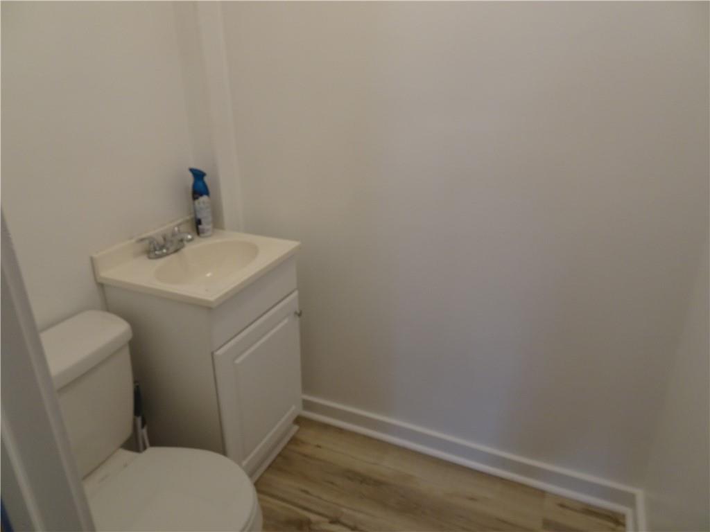 42 Oak Street Manor, PA 15665 - Photo 39 of 39 a bathroom with a sink toilet and vanity