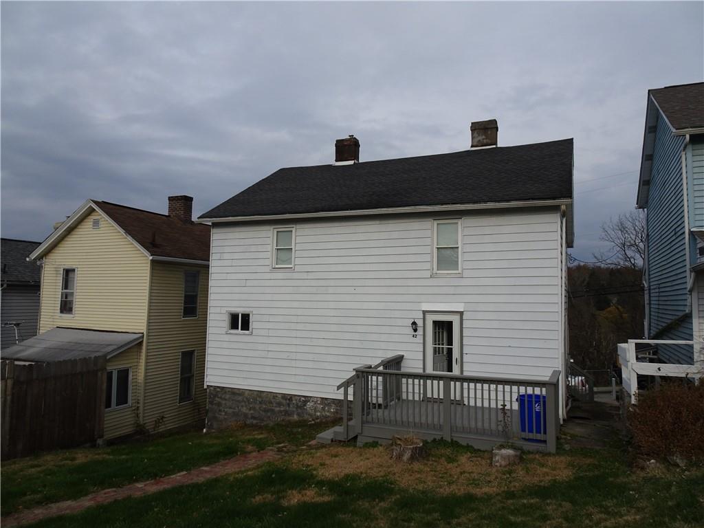 42 Oak Street Manor, PA 15665 - Photo 4 of 39 a front view of a house with a yard