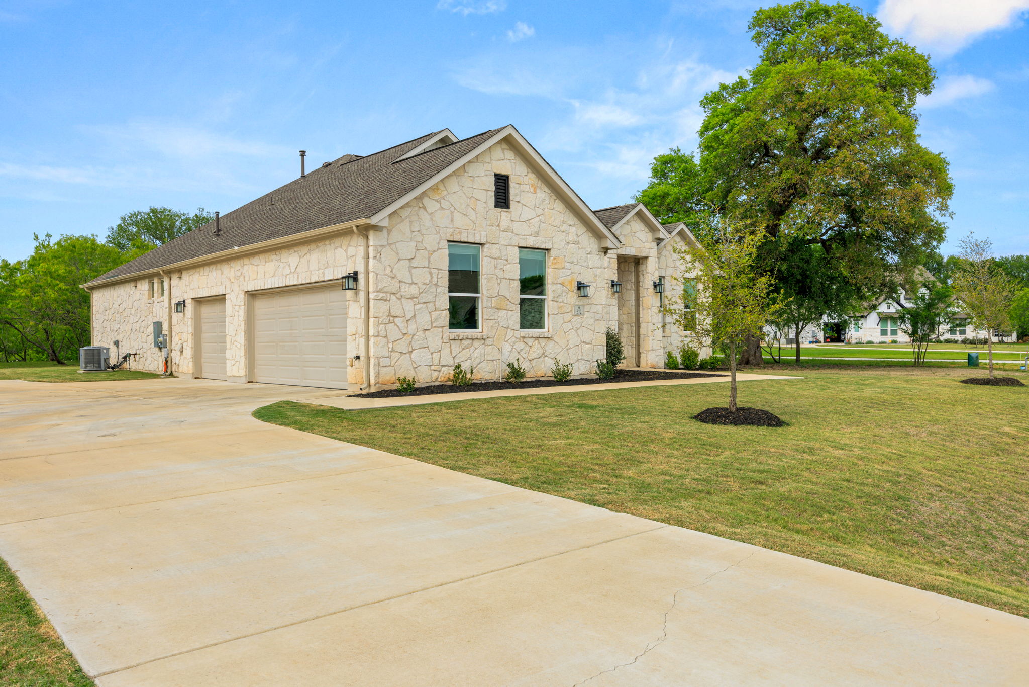 372 Raptor Beak Way Cedar Creek, TX 78612 - Photo 3 of 36 Spacious three-car garage