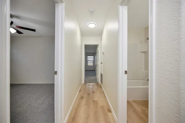a view of a bathroom from a hallway