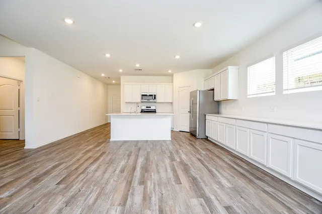 a view of kitchen with wooden floor