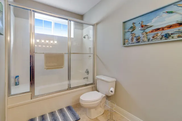 a bathroom with a stove and a mirror