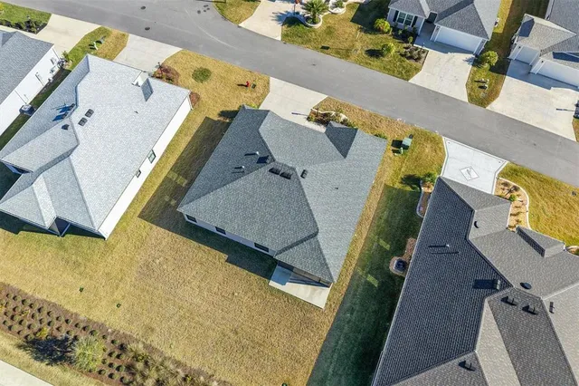 an aerial view of a house with swimming pool