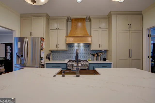 a living room with furniture and a lamp