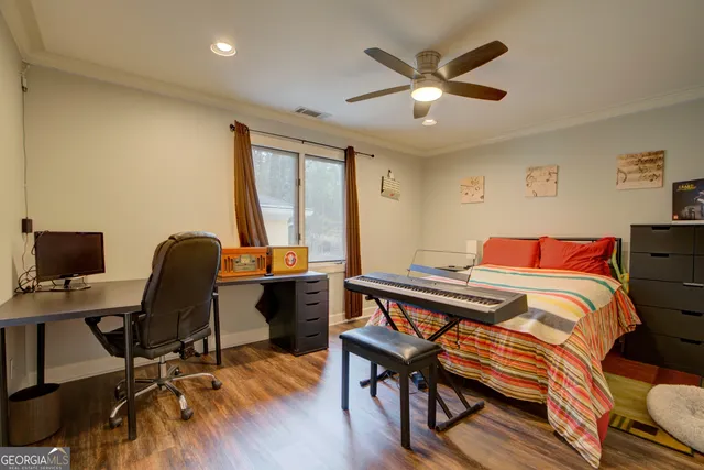 a workspace with furniture and wooden floor