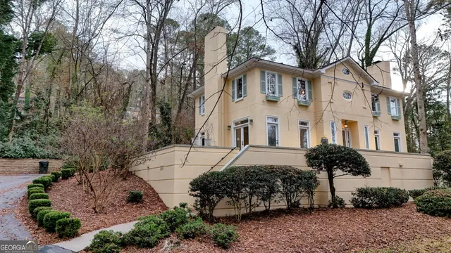 an aerial view of a house with outdoor space