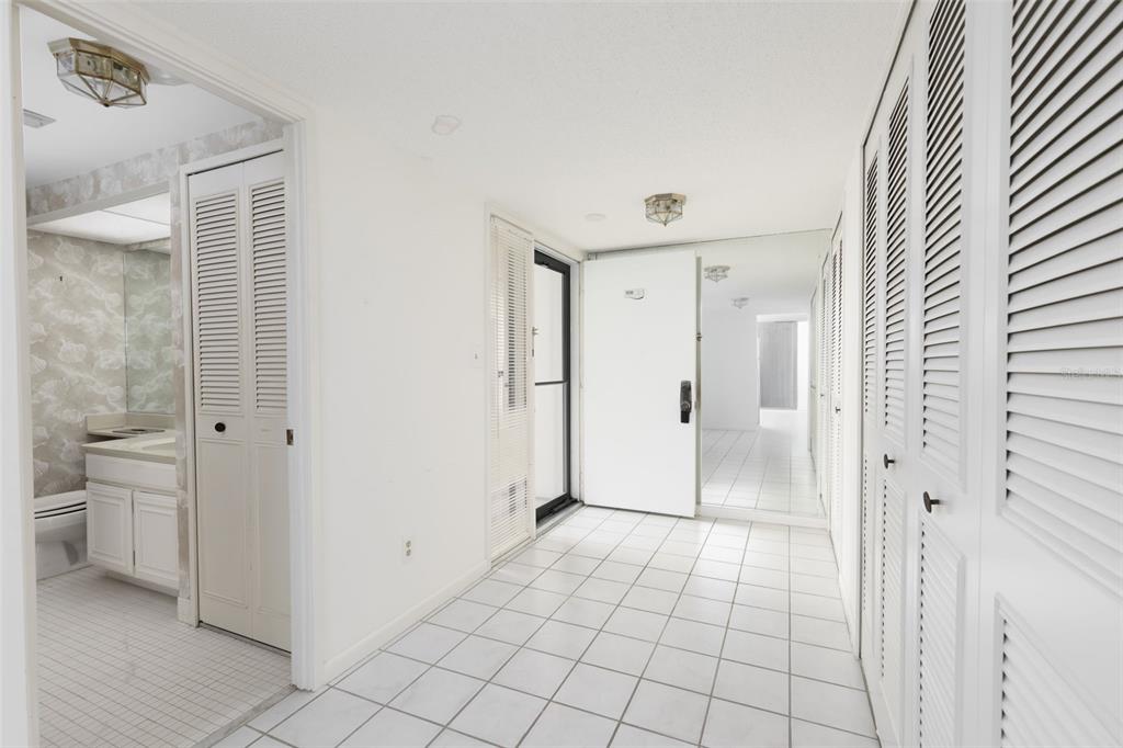 9525 Blind Pass Road, Unit 508 St. Pete Beach, FL 33706 - Photo 7 of 24 a view of a bathroom with a shower and toilet