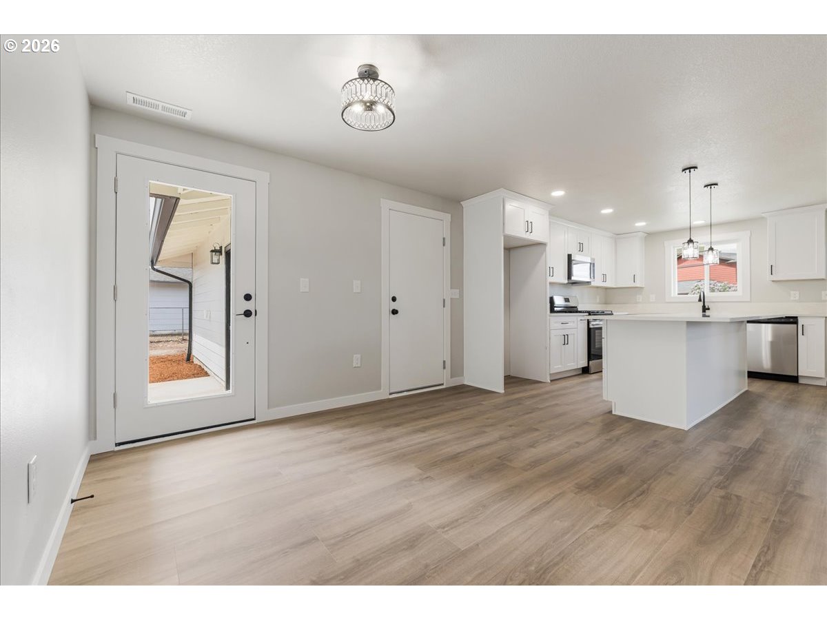 795 Northwest 6th Avenue Canby, OR 97013 - Photo 20 of 40 a view of a kitchen with a sink and cabinets