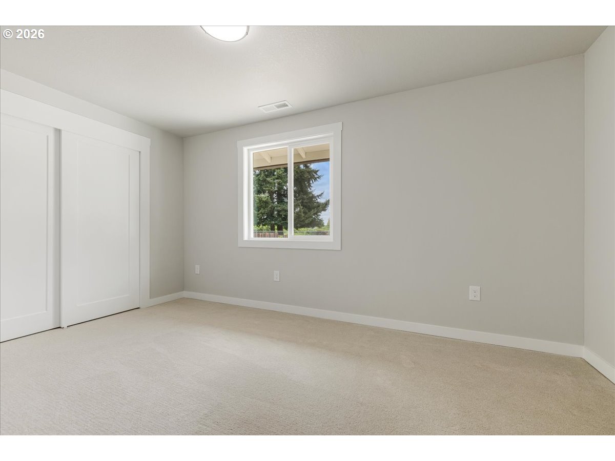 795 Northwest 6th Avenue Canby, OR 97013 - Photo 21 of 40 an empty room with windows