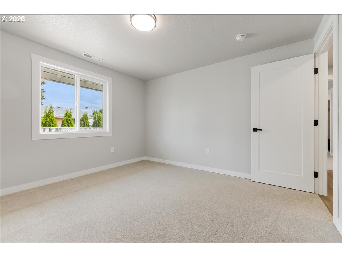 795 Northwest 6th Avenue Canby, OR 97013 - Photo 24 of 40 a view of an empty room with a window
