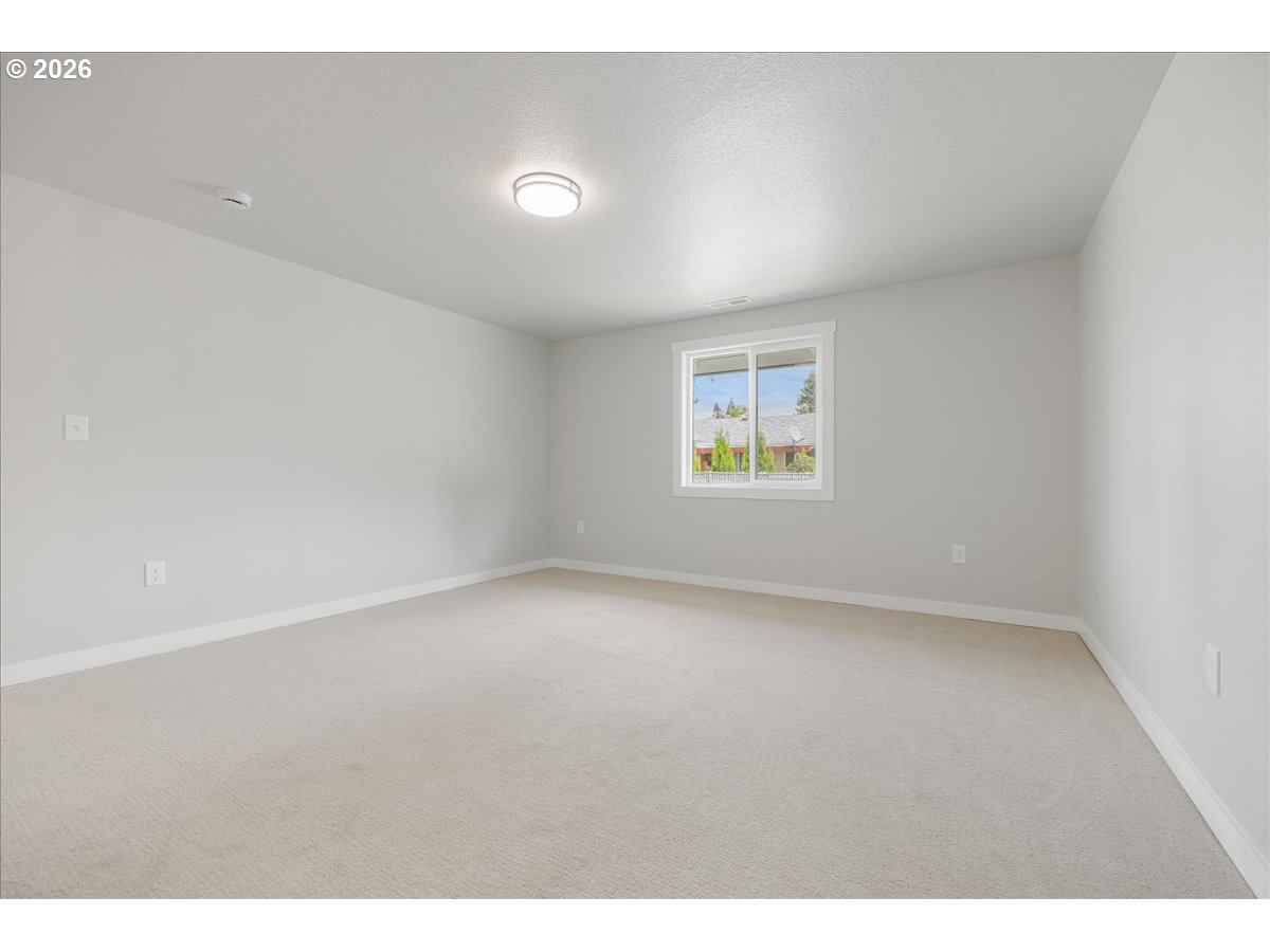 795 Northwest 6th Avenue Canby, OR 97013 - Photo 32 of 40 a view of an empty room with a window