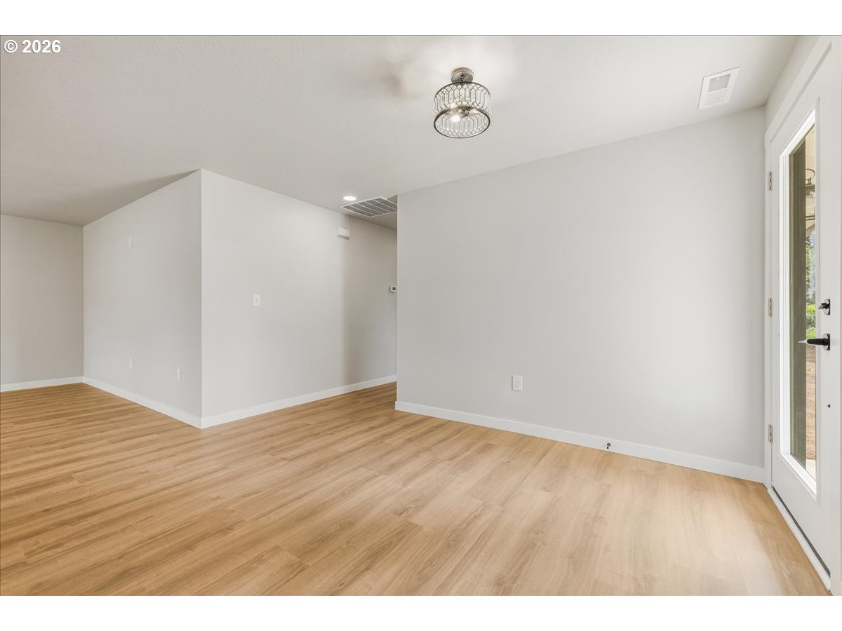 795 Northwest 6th Avenue Canby, OR 97013 - Photo 34 of 40 a view of an empty room and wooden floor