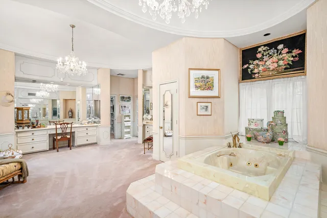 a spacious bathroom with a tub double sink and shower
