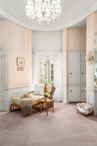 a bedroom with furniture and a window