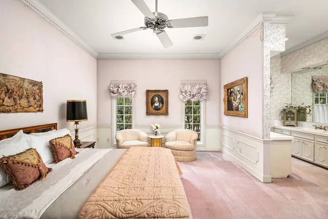 a bedroom with a large bed and a couch