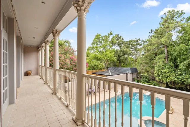 a view of a balcony with wooden floor