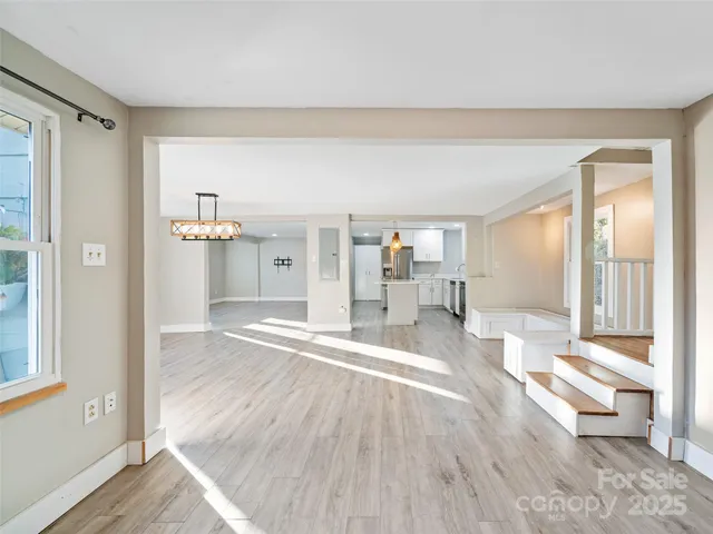 a view of a living room and hardwood floor