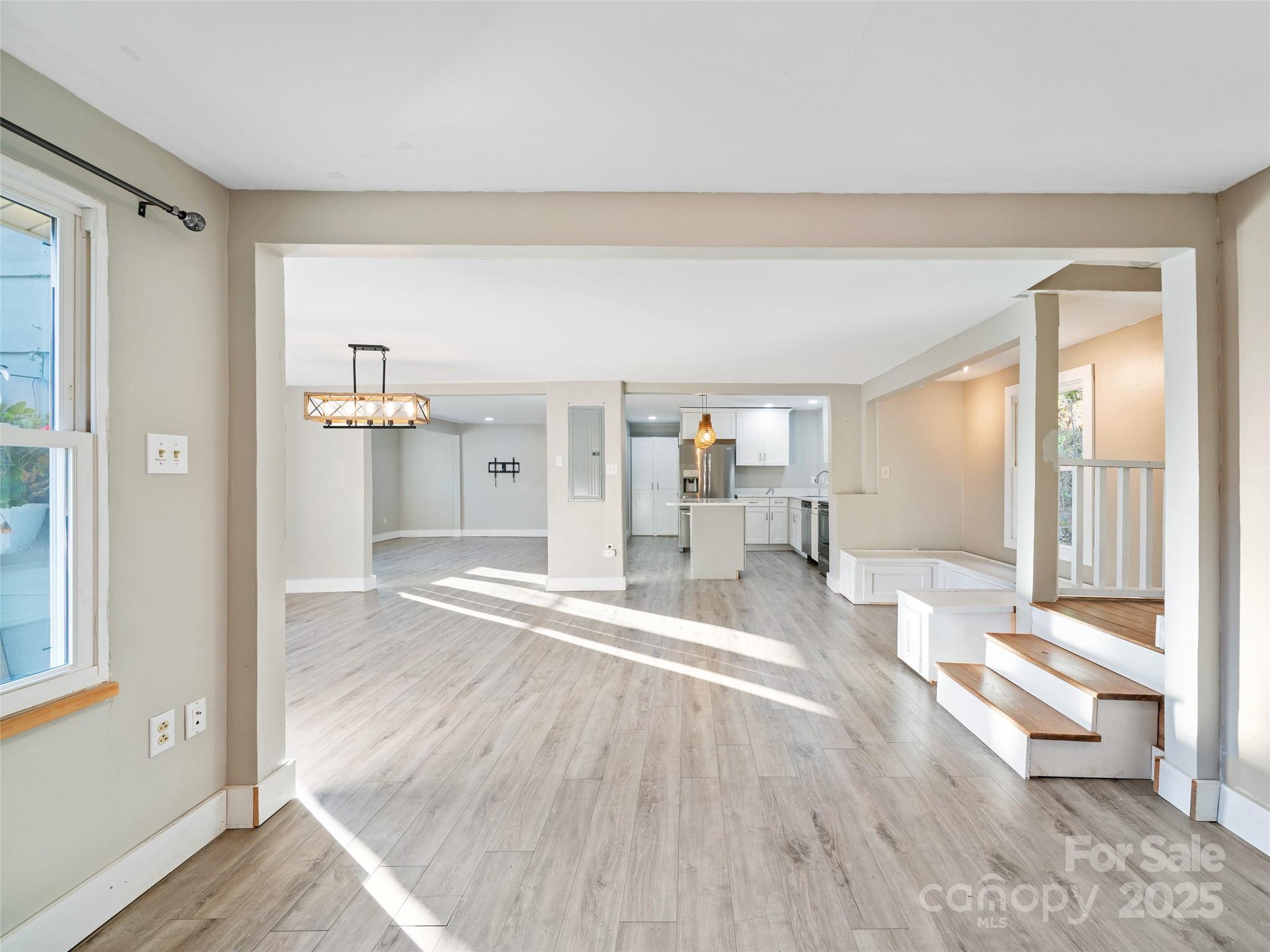 3477 Cane Creek Road Bakersville, NC 28705 - Photo 13 of 30 a view of a living room and hardwood floor