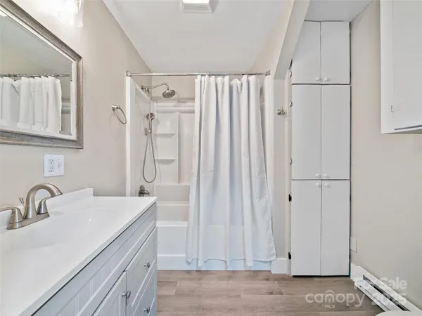 a bathroom with a double vanity sink and a mirror