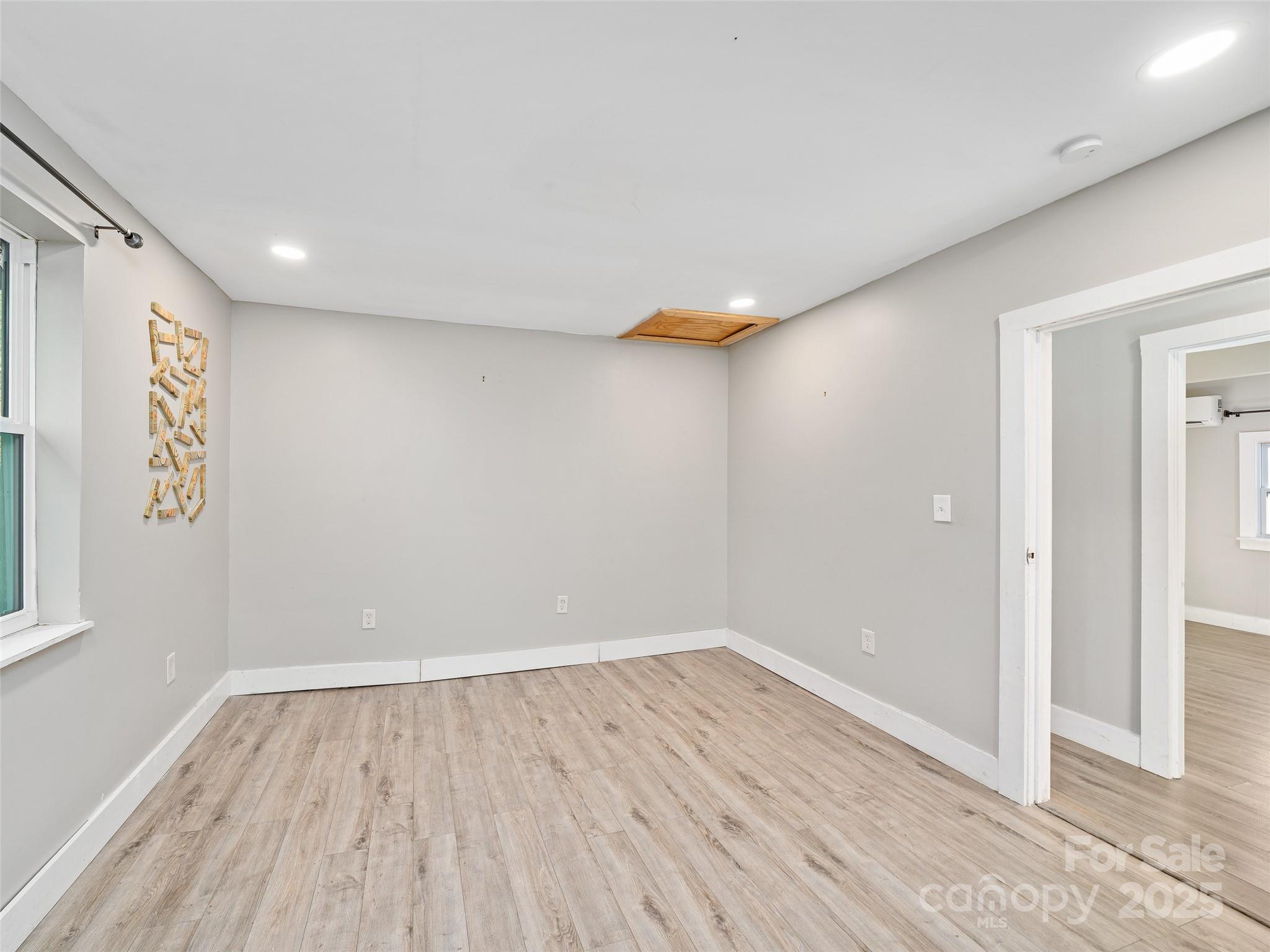 3477 Cane Creek Road Bakersville, NC 28705 - Photo 19 of 30 wooden floor in an empty room