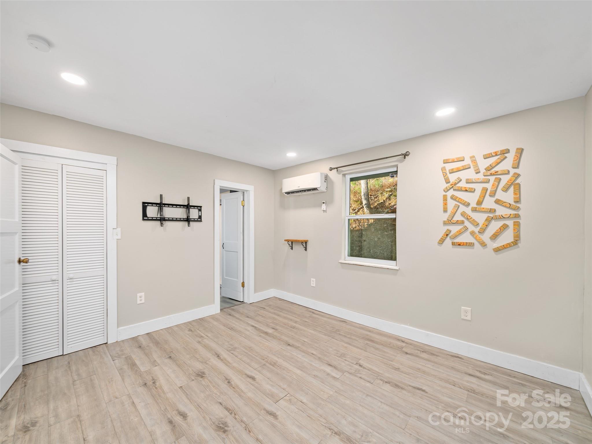 3477 Cane Creek Road Bakersville, NC 28705 - Photo 20 of 30 an empty room with windows and closet