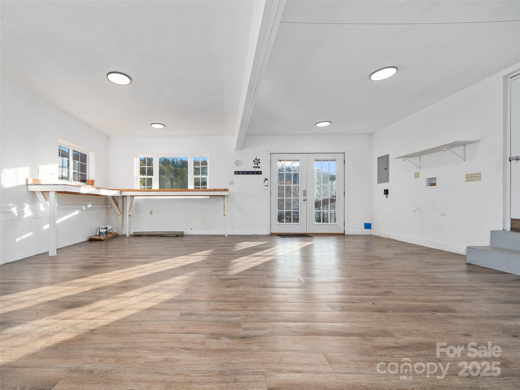 3477 Cane Creek Road Bakersville, NC 28705 - Photo 25 of 30 an empty room with wooden floor and windows