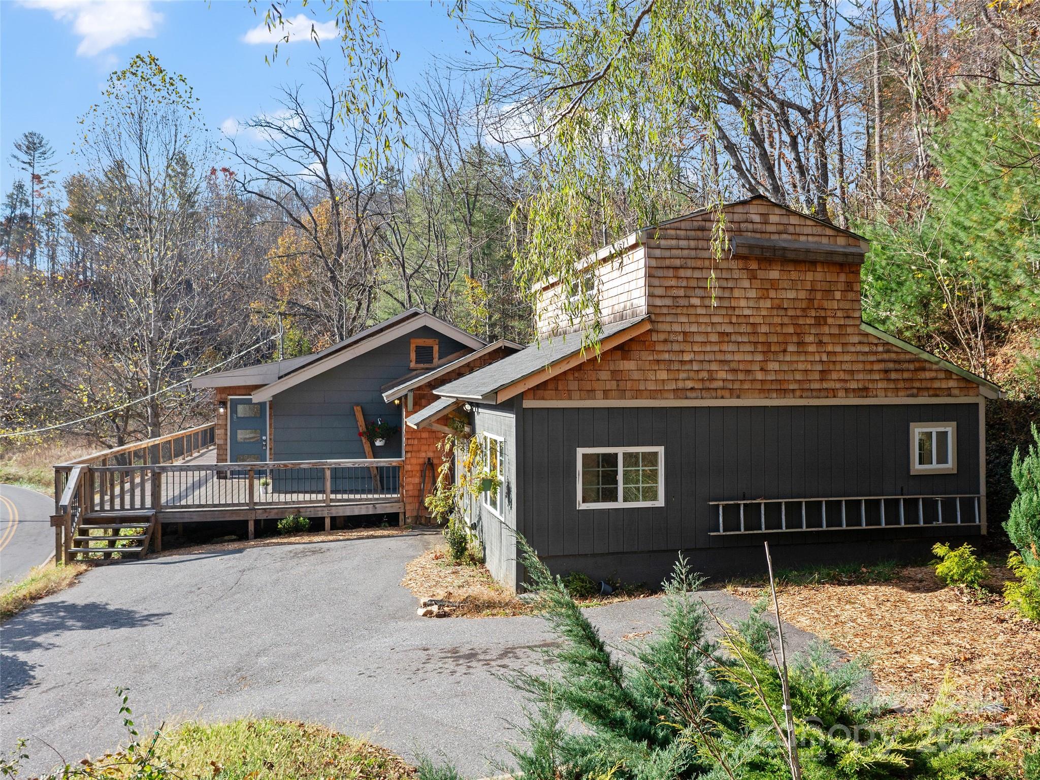 3477 Cane Creek Road Bakersville, NC 28705 - Photo 26 of 30 a view of a house with a yard