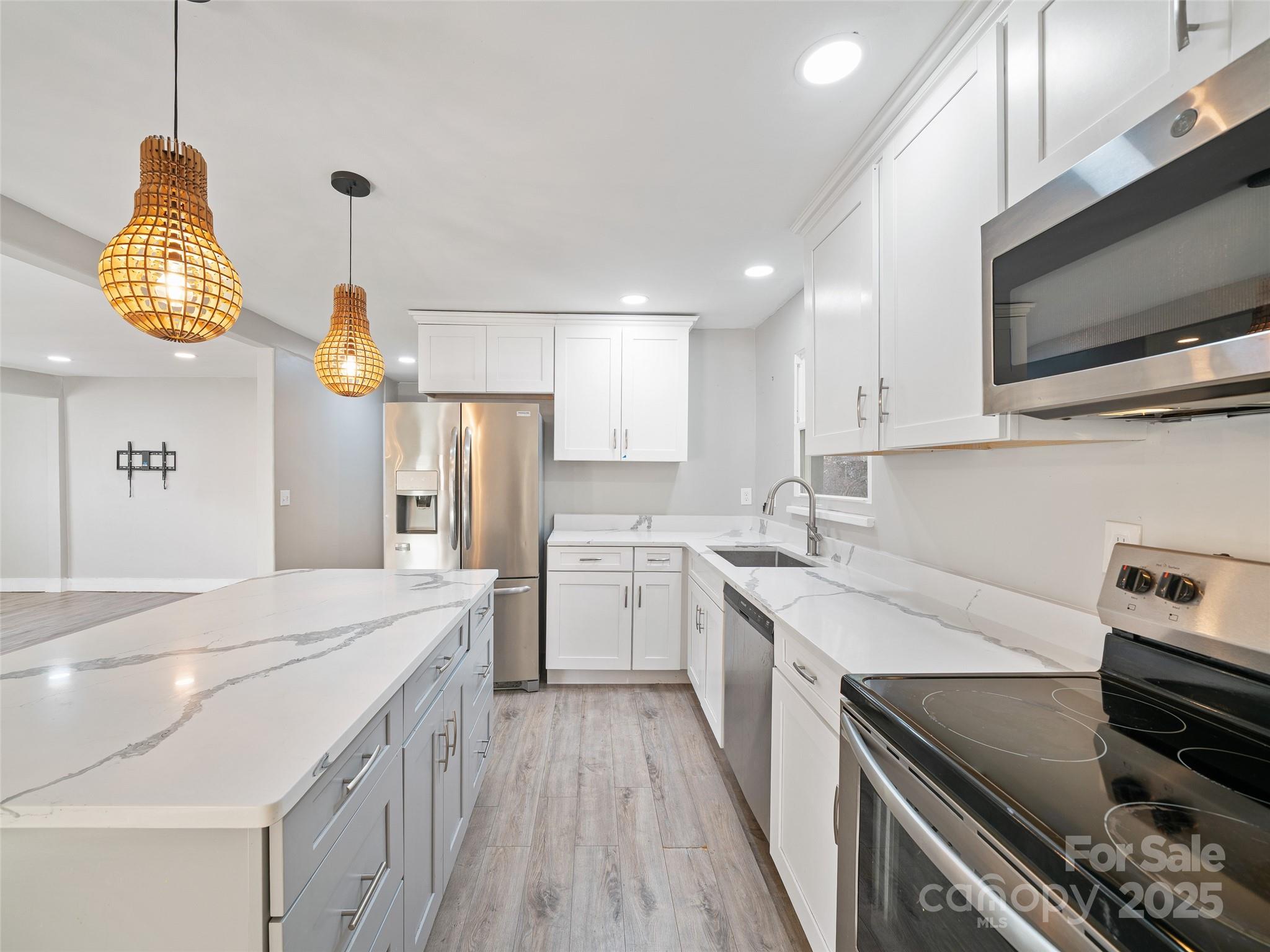 3477 Cane Creek Road Bakersville, NC 28705 - Photo 9 of 30 a kitchen with a sink appliances and cabinets