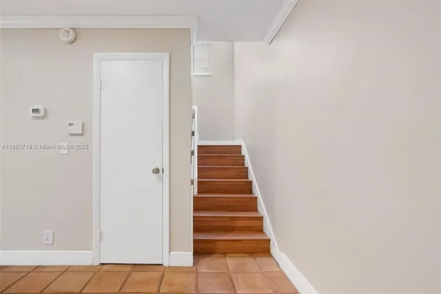 a view of wooden floor and windows in a room
