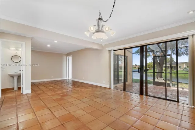 a view of an empty room with glass door