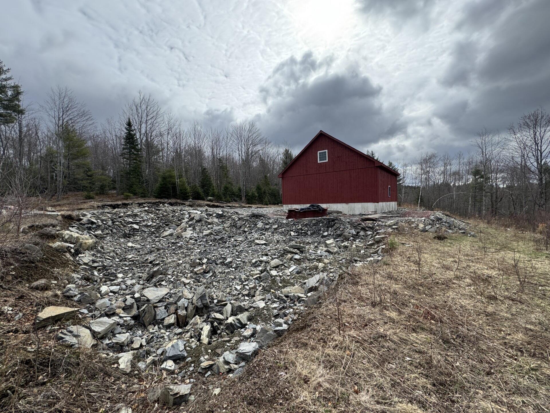 343 Guilford Center Road Guilford, ME 04443 - Photo 8 of 16 8-Basement hole blasted & ready to excav