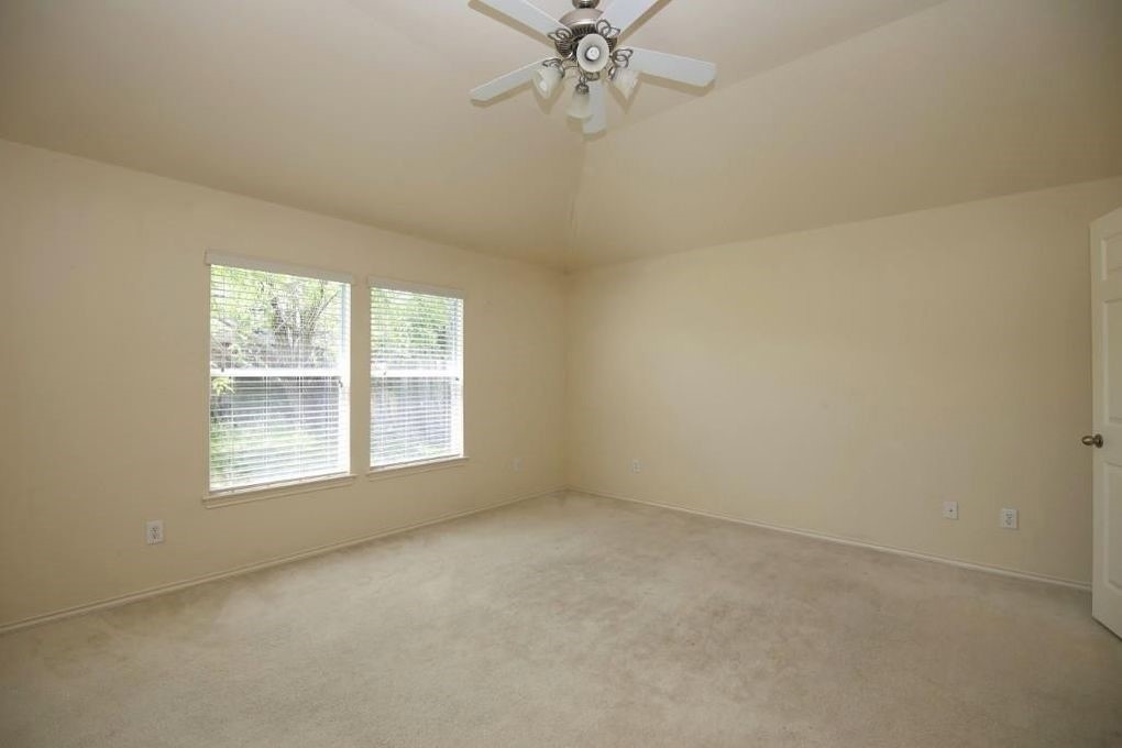 17223 Valhallah Way Houston, TX 77095 - Photo 8 of 14 an empty room with a window