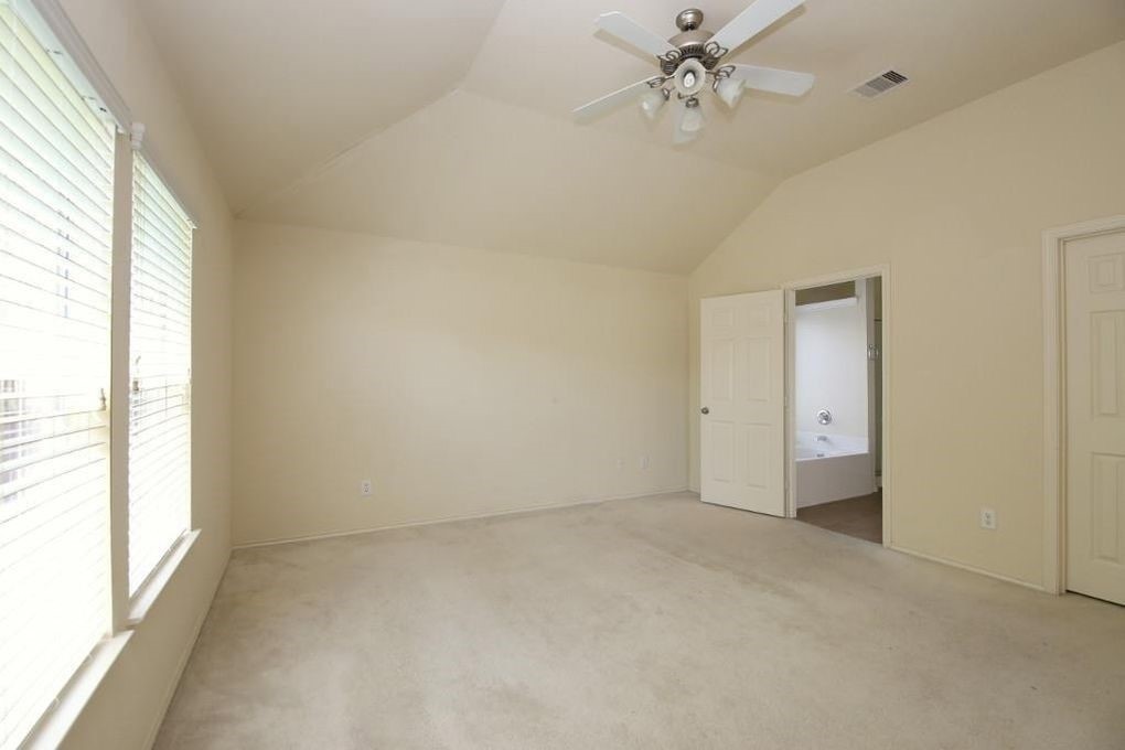 17223 Valhallah Way Houston, TX 77095 - Photo 9 of 14 a view of an empty room with a window