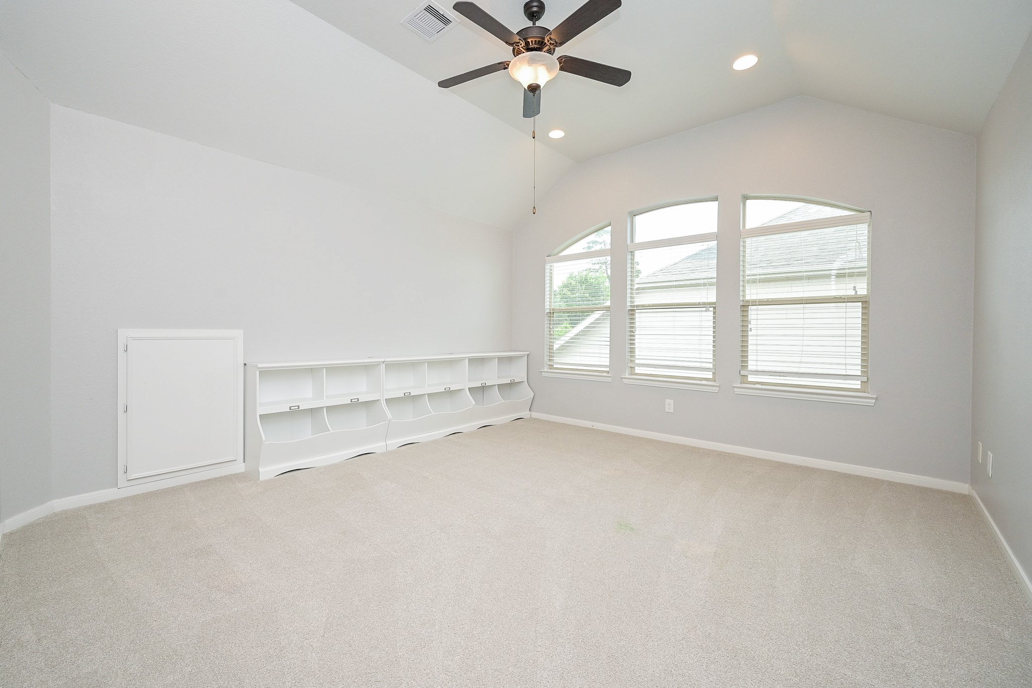 11 South Victoriana Circle Spring, TX 77389 - Photo 26 of 38 an empty room with a ceiling fan and window