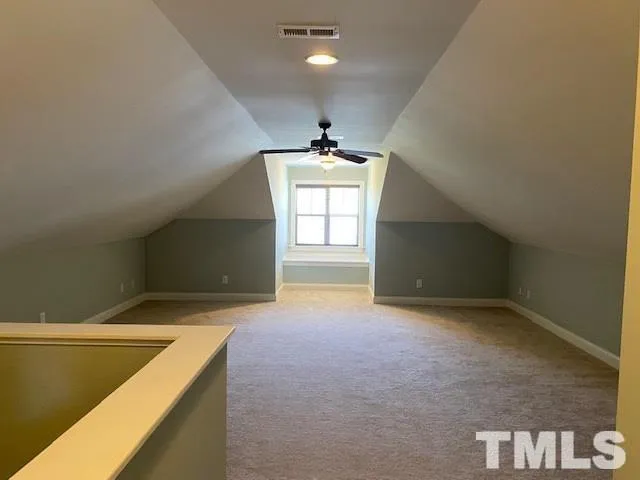 a bathroom with a sink a toilet and window