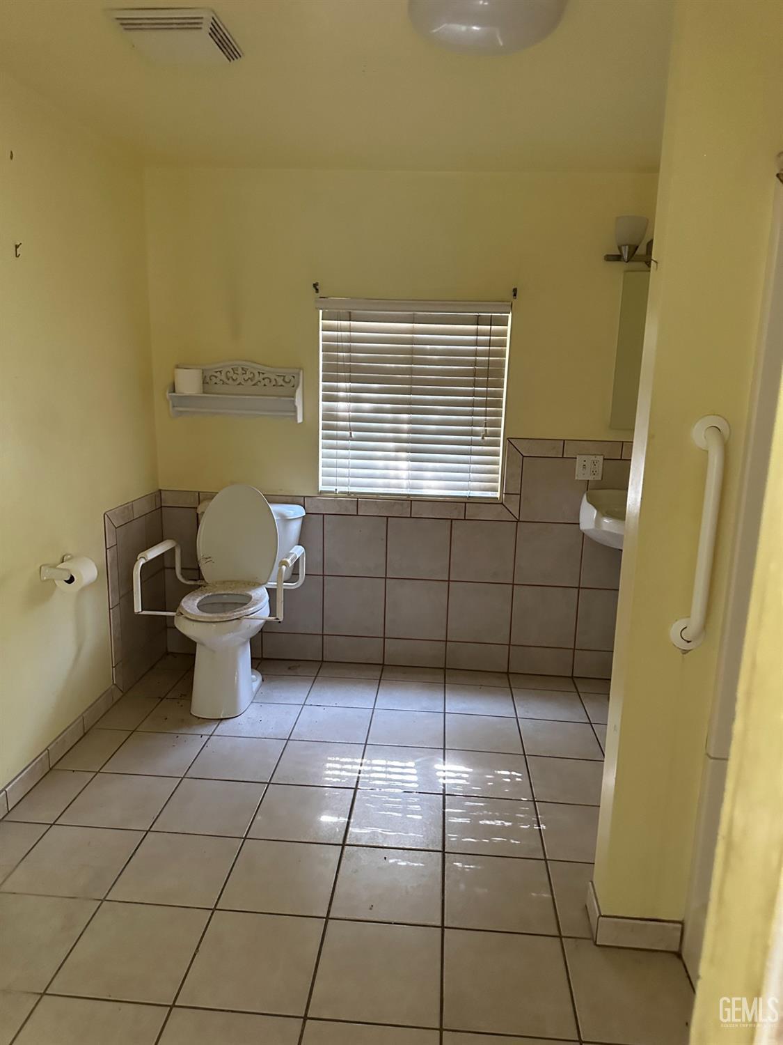 Undisclosed Address Bakersfield, CA 93305 - Photo 12 of 19 a bathroom with a toilet