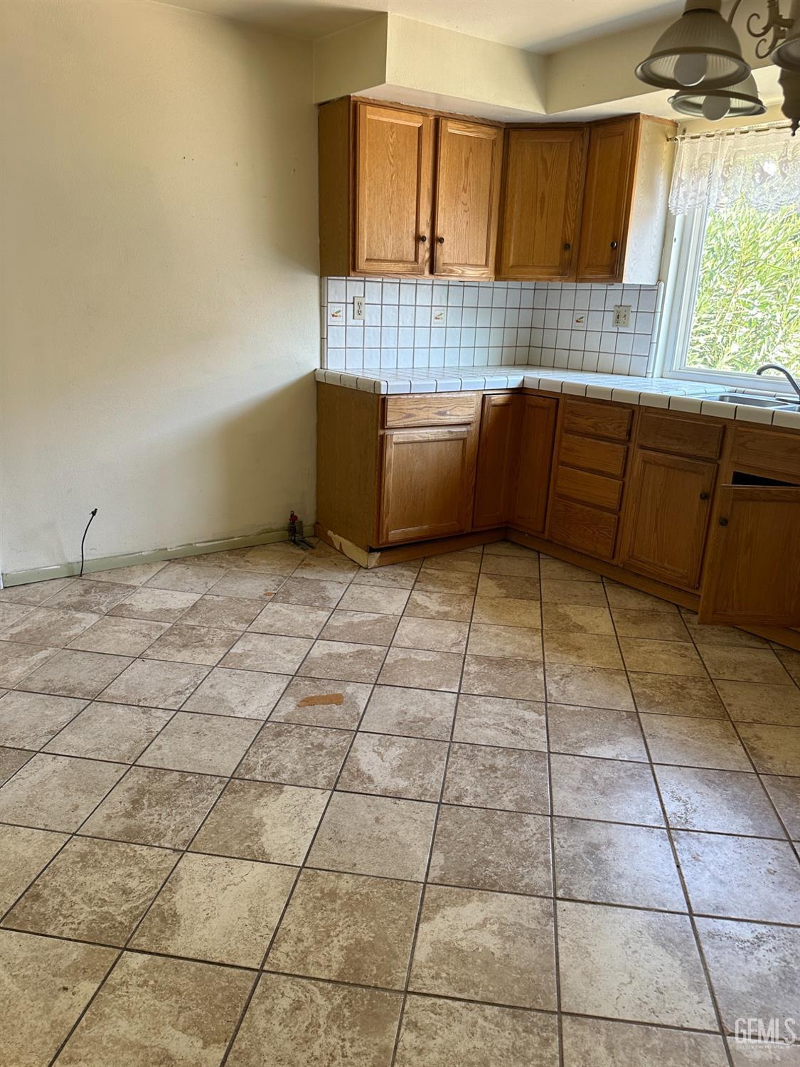 Undisclosed Address Bakersfield, CA 93305 - Photo 4 of 19 a view of a kitchen with a sink