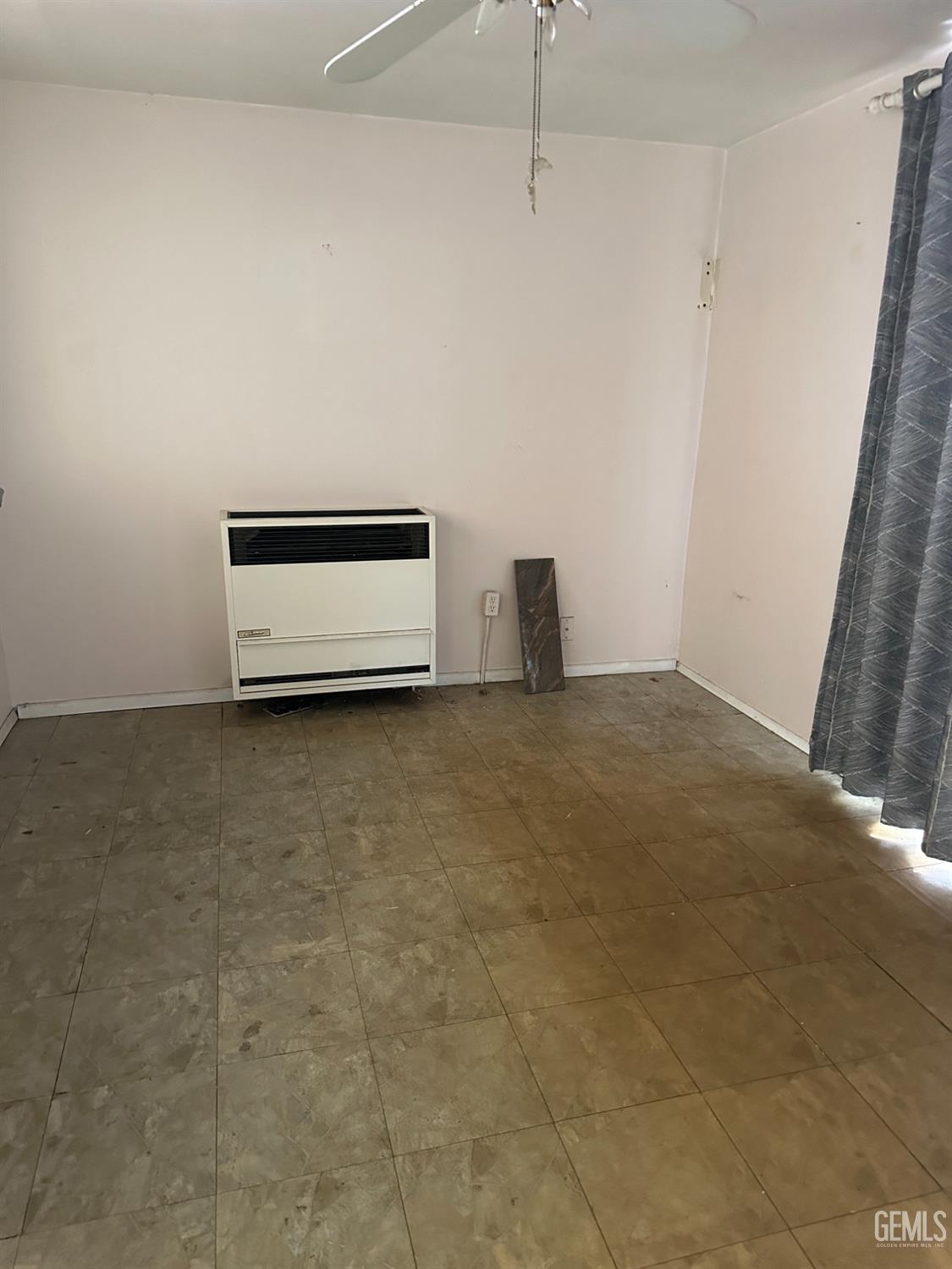 Undisclosed Address Bakersfield, CA 93305 - Photo 8 of 19 a view of empty room with ceiling fan