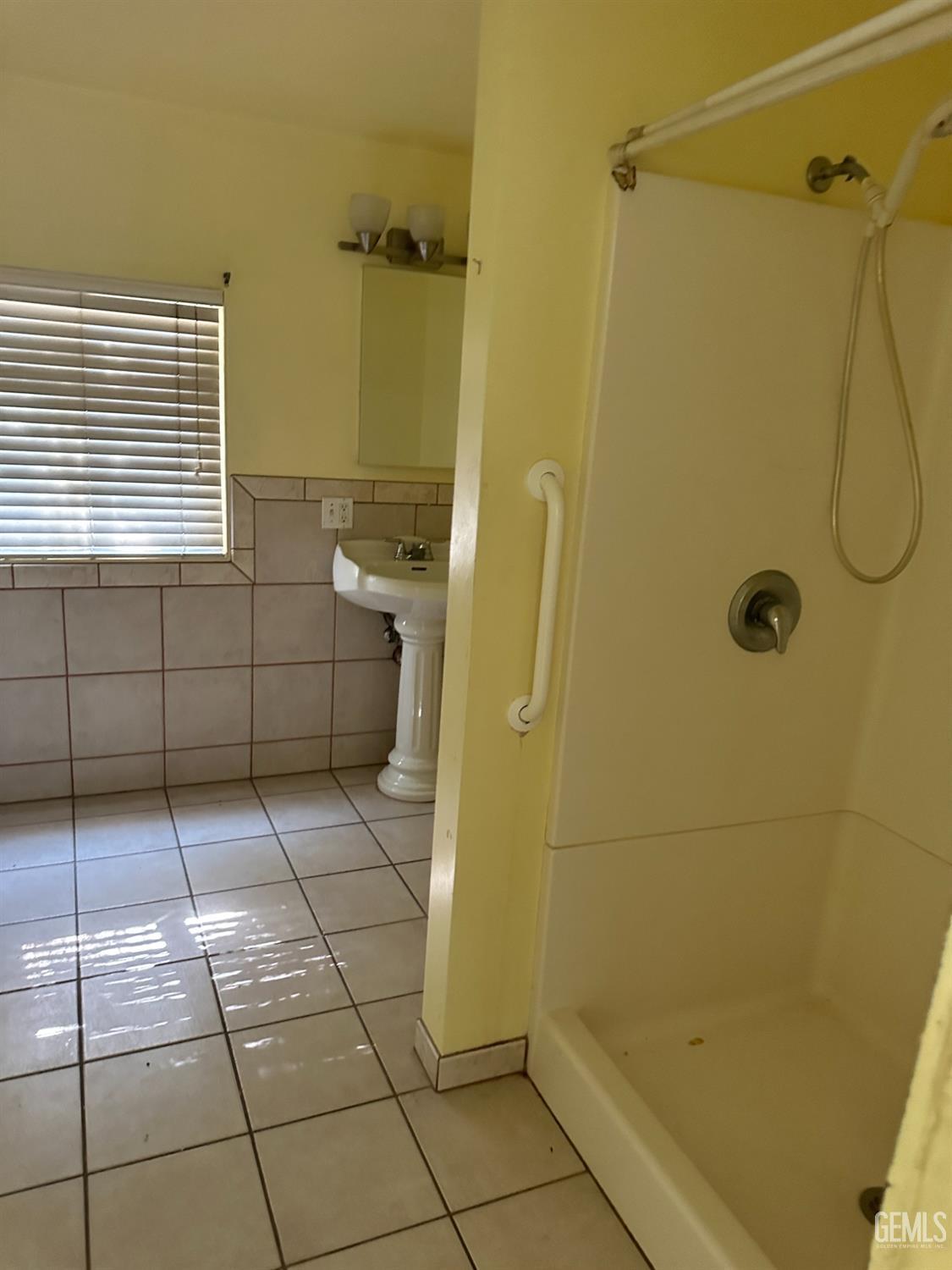 Undisclosed Address Bakersfield, CA 93305 - Photo 10 of 19 a bathroom with a shower