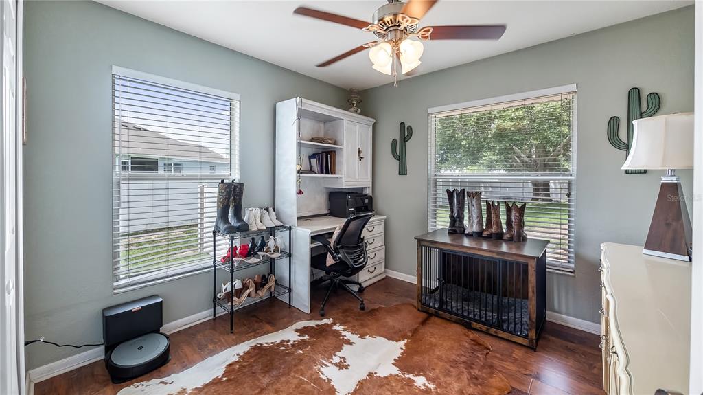11746 Oswalt Road Clermont, FL 34711 - Photo 25 of 35 a view of a workspace with furniture and a window
