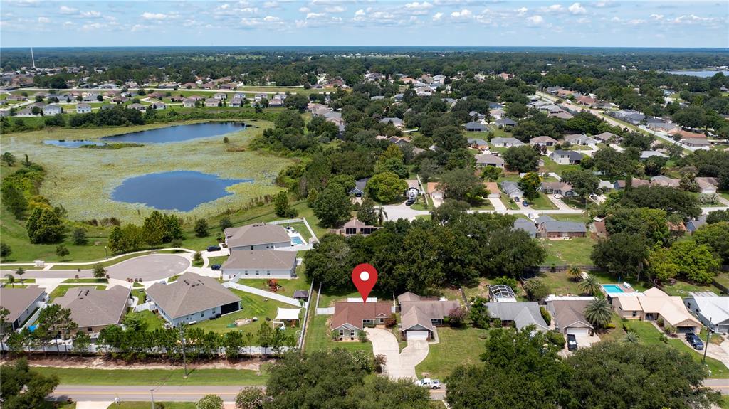 11746 Oswalt Road Clermont, FL 34711 - Photo 32 of 35 an aerial view of residential houses and outdoor space