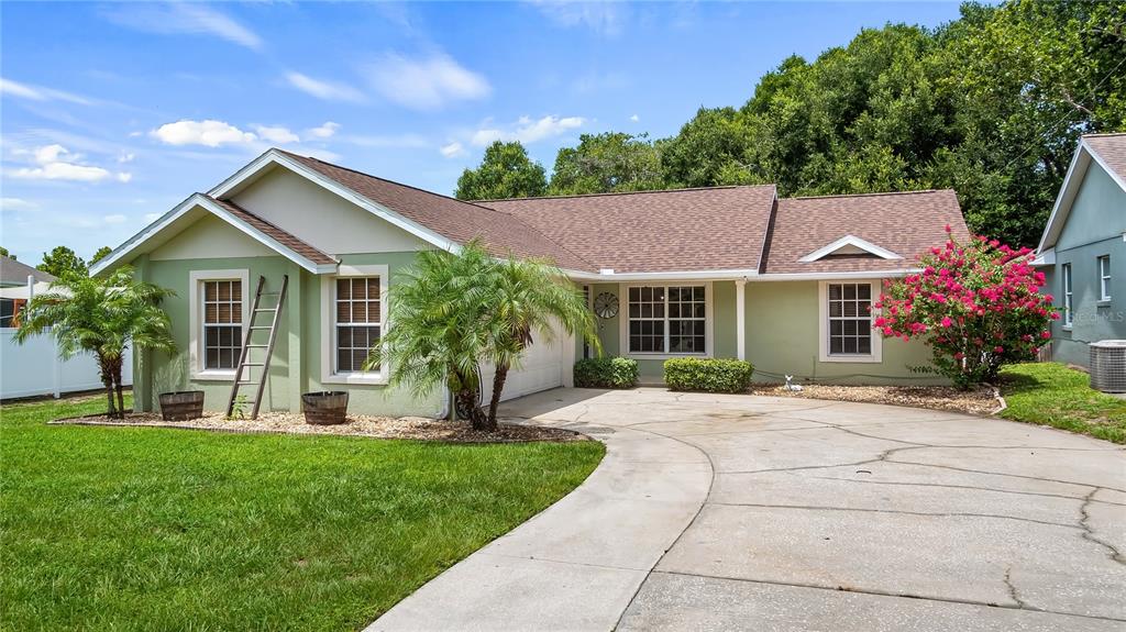 11746 Oswalt Road Clermont, FL 34711 - Photo 35 of 35 a front view of a house with a yard and porch