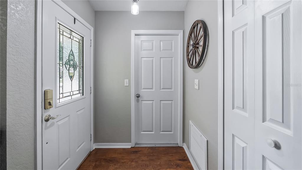 11746 Oswalt Road Clermont, FL 34711 - Photo 5 of 35 a view of a door and a mirror on a door