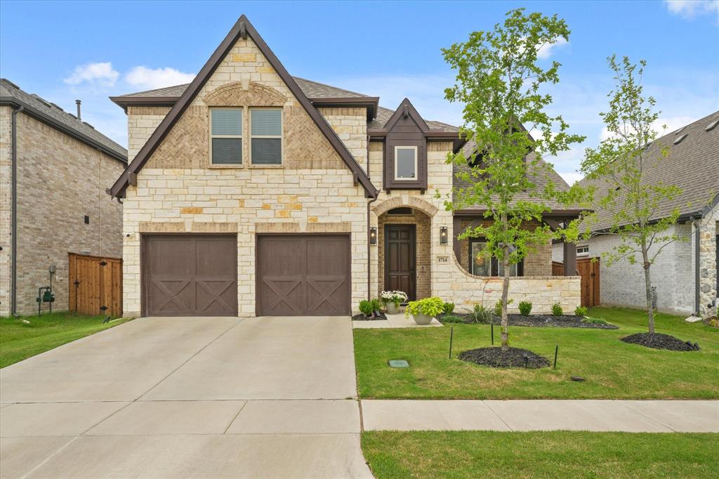 1714 Highwood Road Forney, TX 75126 - Photo 1 of 30 Elegant two-story stone and brick exterior with peaked gable roofline and arched entryway