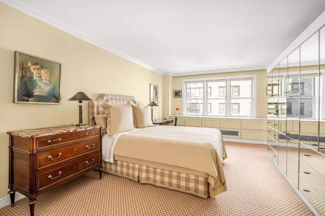 a kitchen with stove and white cabinets