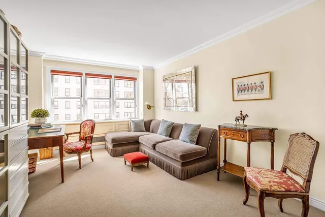 a bedroom with a large bed and a large window