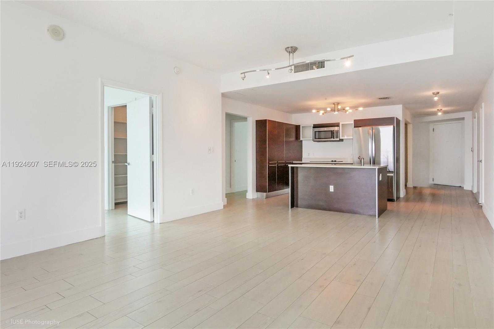 1900 North Bayshore Drive, Unit 2615 Miami, FL 33132 - Photo 12 of 17 a view of a kitchen with a sink and cabinets