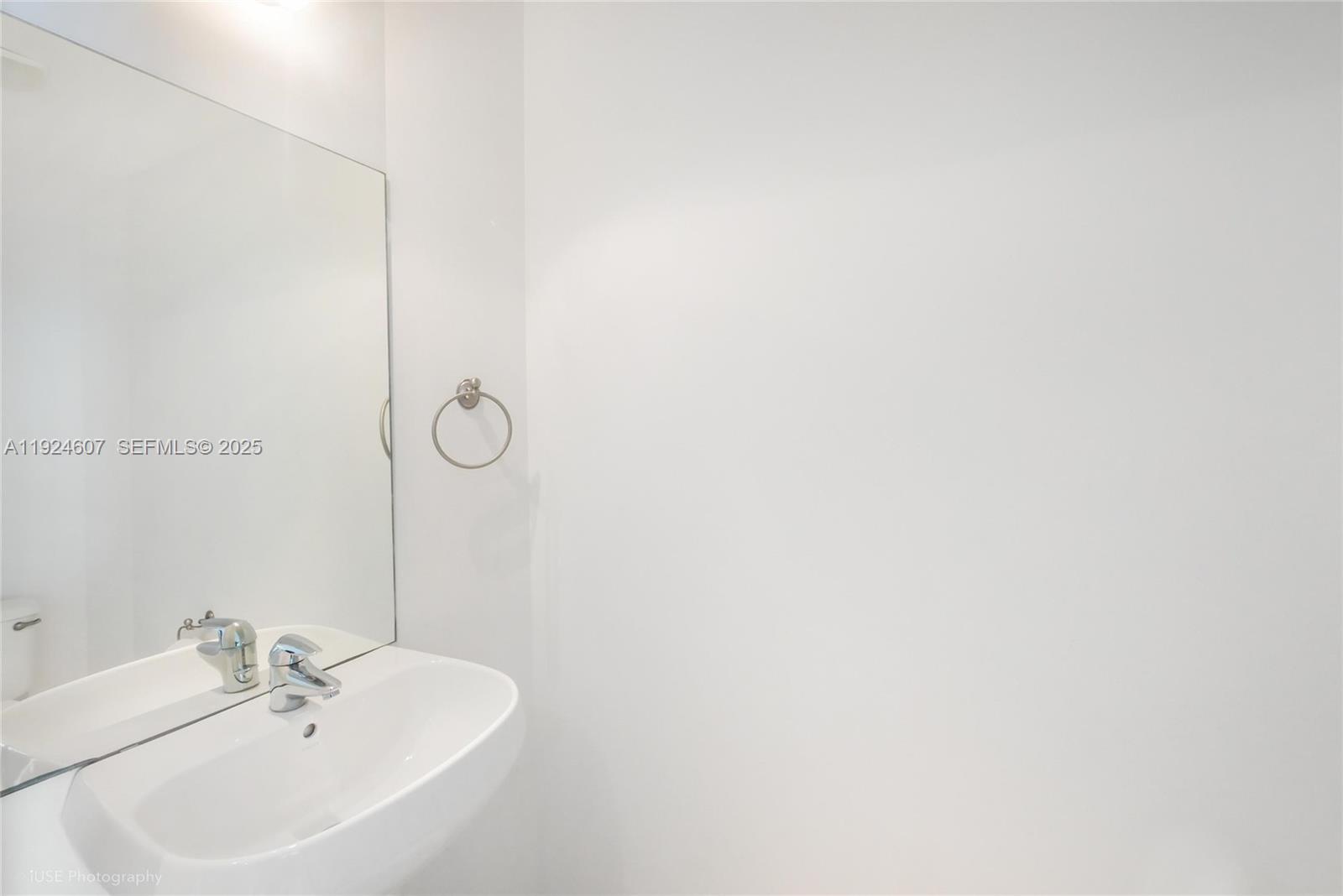 1900 North Bayshore Drive, Unit 2615 Miami, FL 33132 - Photo 9 of 17 a bathroom with a sink and a mirror