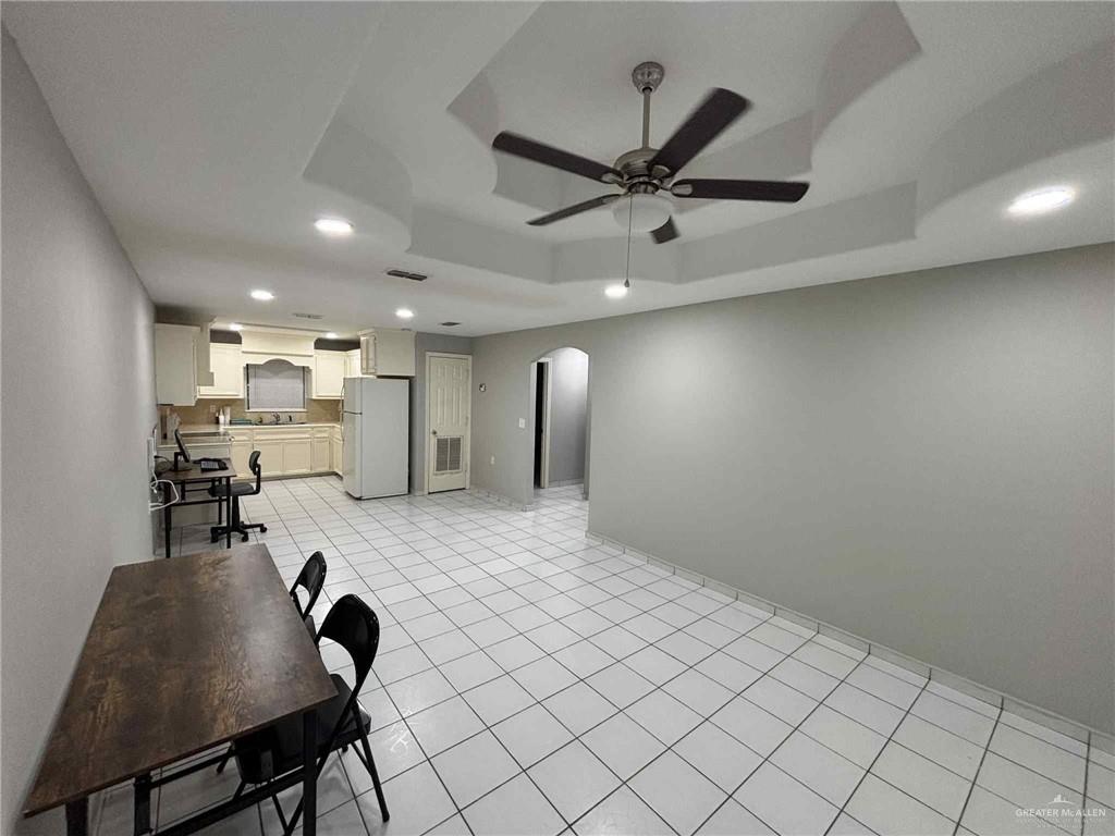 144 Redwood Road, Unit 2 Rio Grande City, TX 78582 - Photo 4 of 10 a living room with stainless steel appliances furniture a rug and a view of kitchen